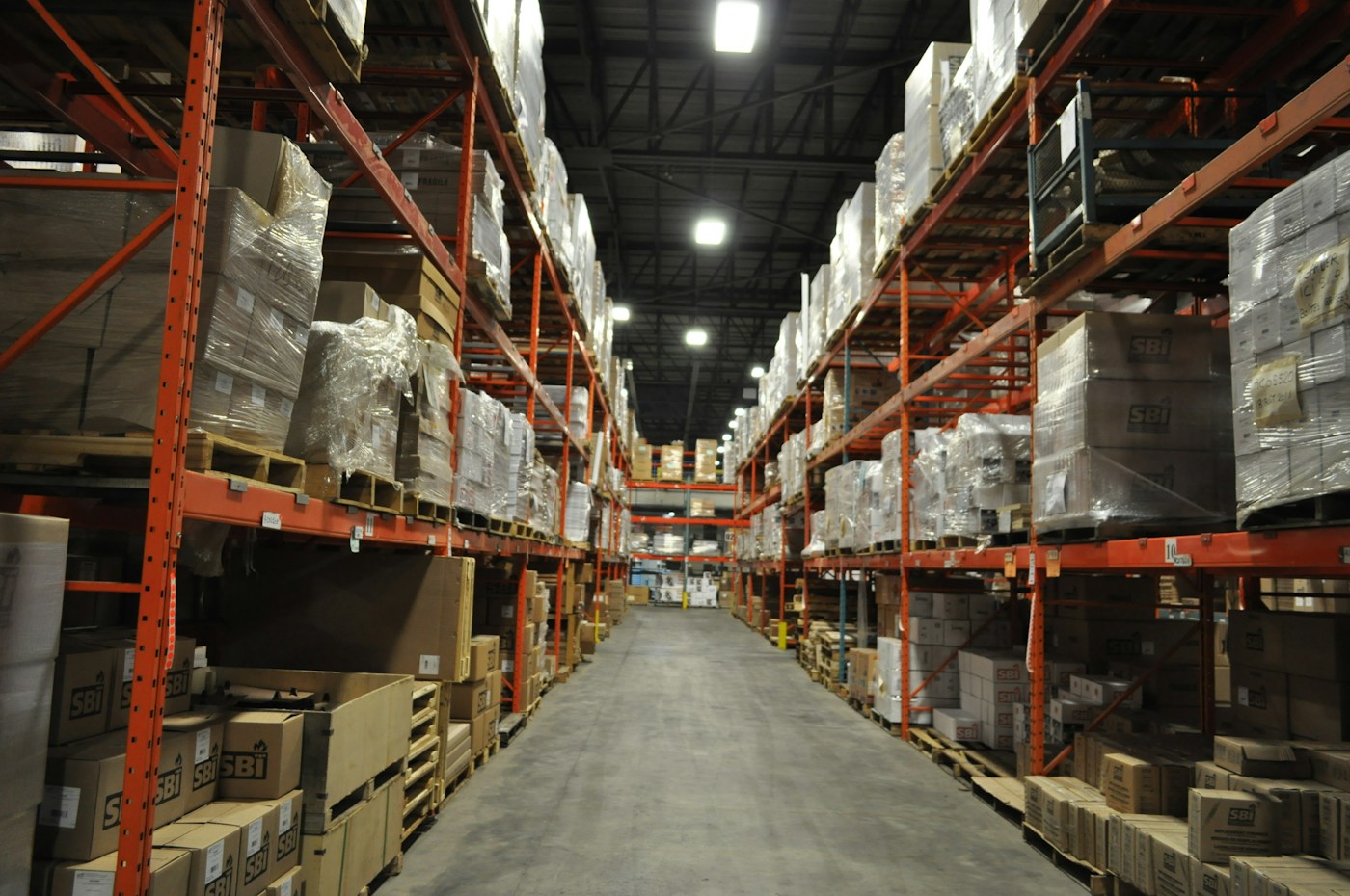 Warehouse shelves with boxed stock — illustrative stock photograph